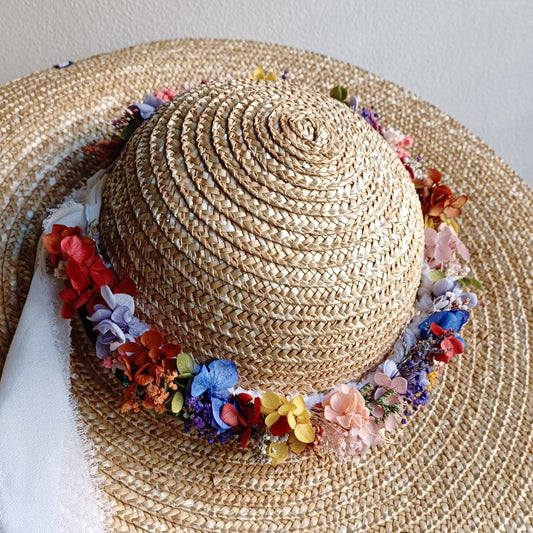 Boho-style flower crown made of preserved flowers with a soft white ribbon for adjustable fit.