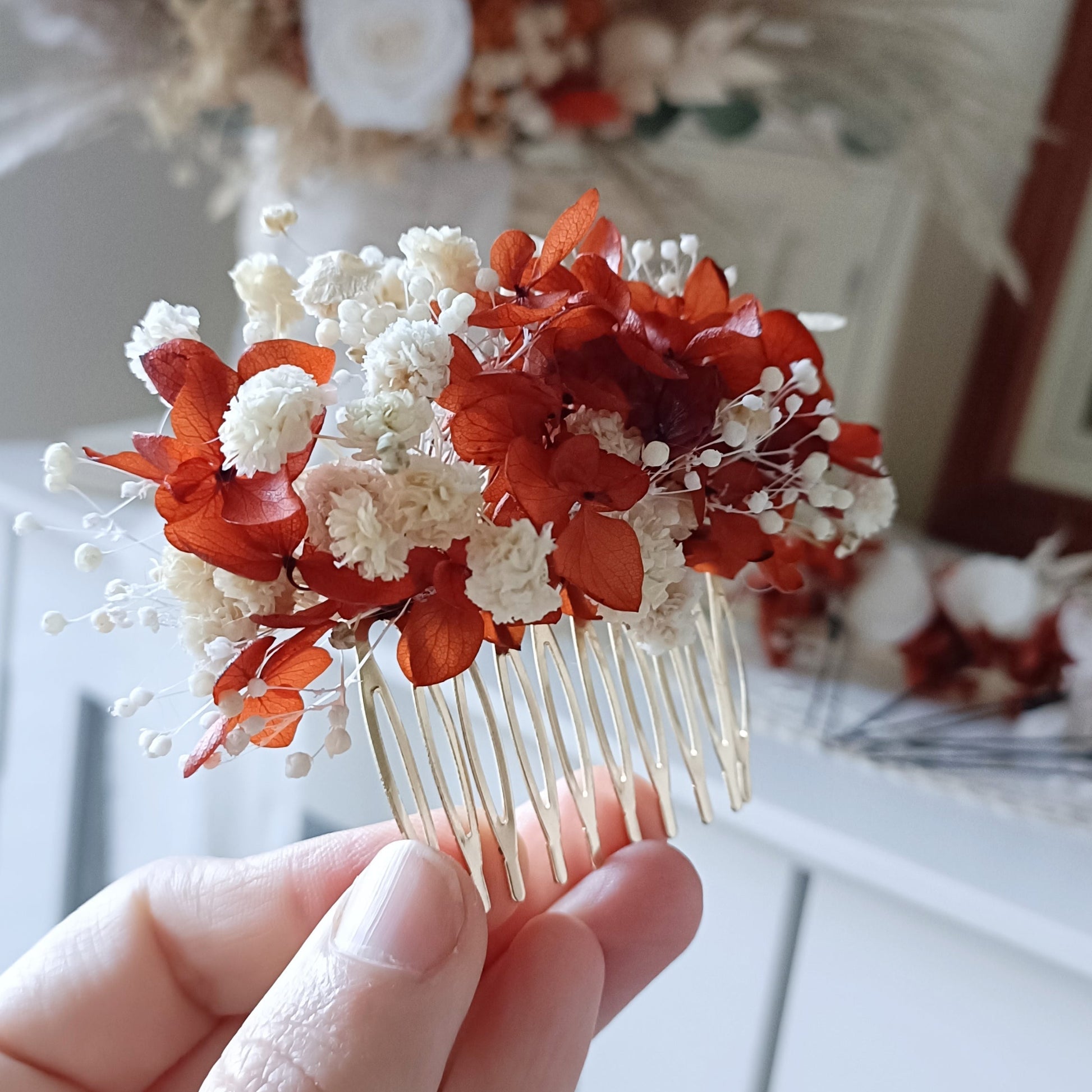 Boho wedding hairpiece set featuring terracotta florals, white accents, and natural textures