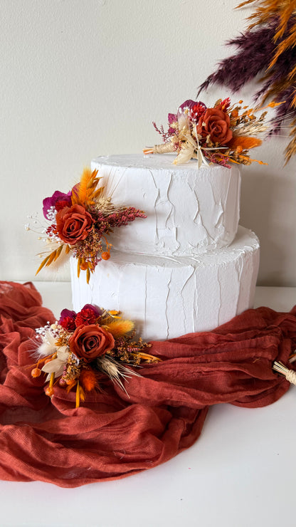 Burnt orange and burgundy dried cake flowers for autumn wedding cake decoration