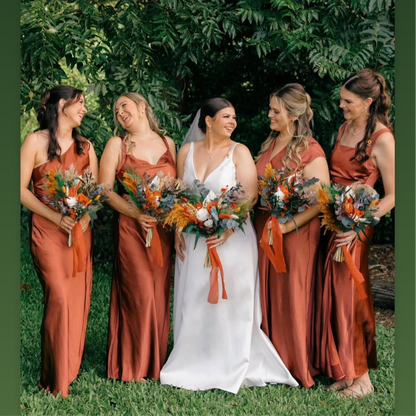 Burnt orange and terracotta dried wedding flowers featuring bridal bouquet, bridesmaid bouquets, ceremony florals and preserved wedding arrangements in warm earthy tones.