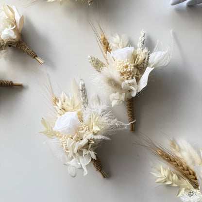 Champagne and ivory boutonniere with preserved rose, dried flowers and wheat accents