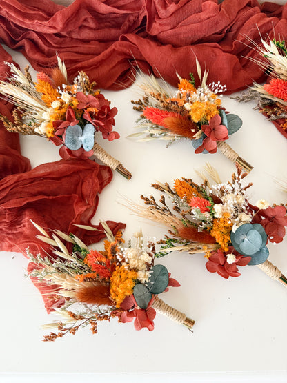 Set of dried flower boutonnieres in matching burnt orange and beige tones — perfect for groomsmen, rustic or boho weddings in Australia.