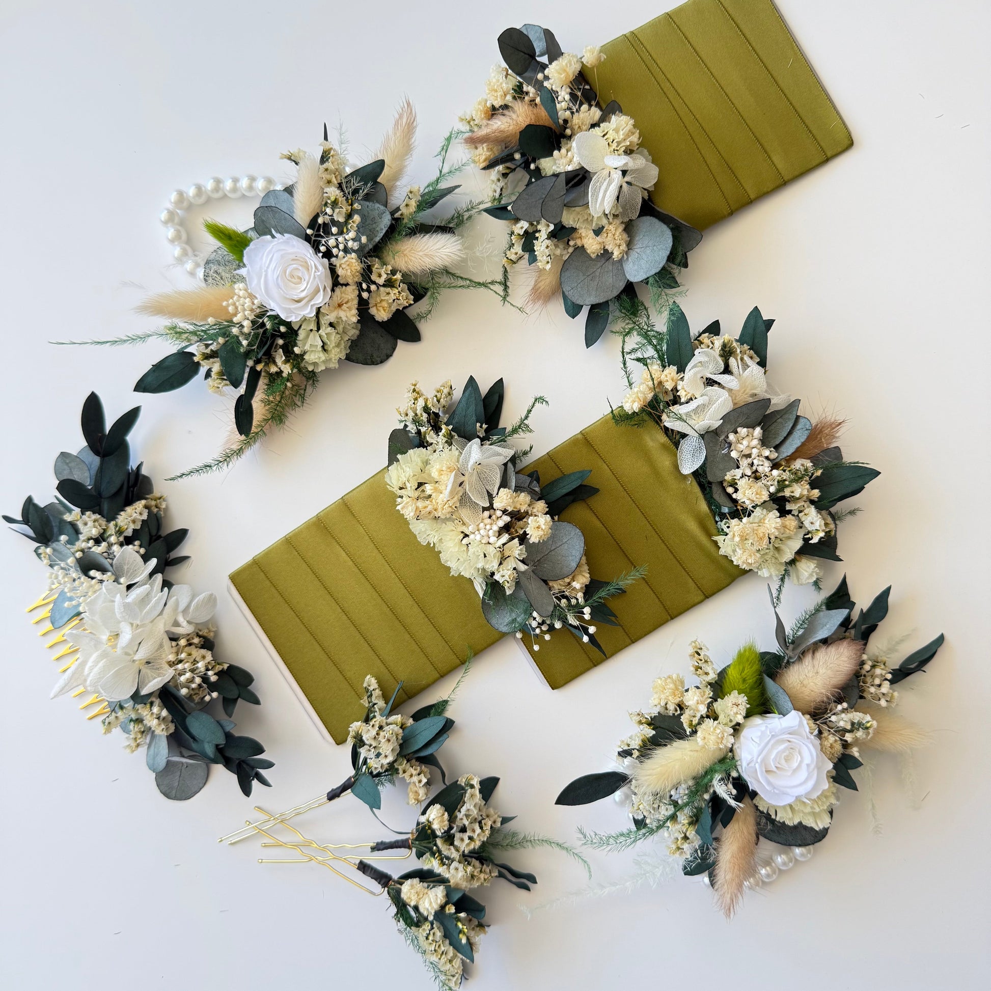 Matching dried flower pocket boutonniere and comb with white flowers, preserved eucalyptus and beige accents.