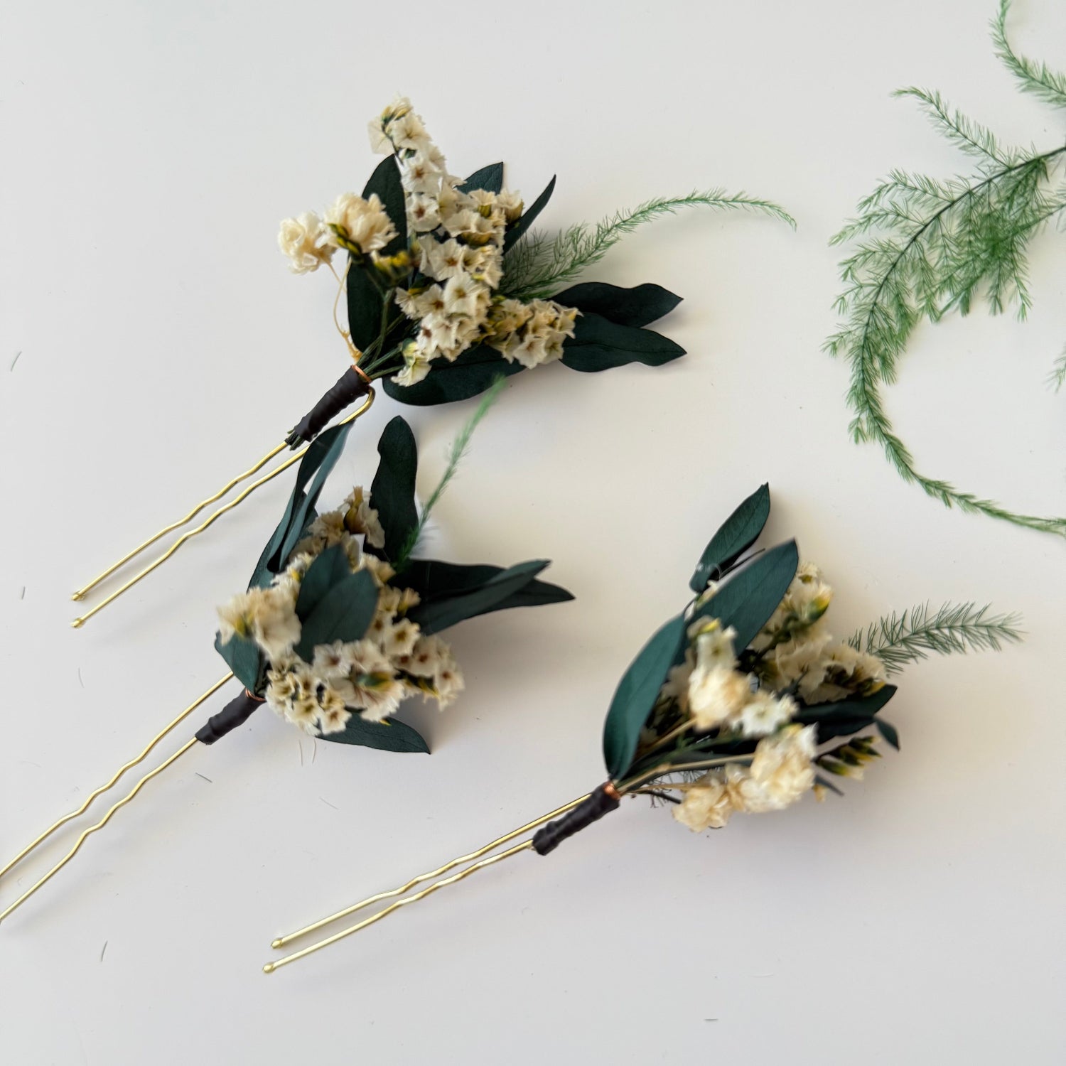 Handmade set of dried flower hair pins and boutonniere with neutral beige and green tones for boho wedding style