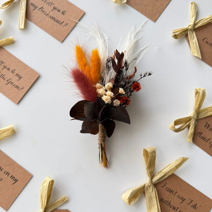 Dried flower arrangement with rustic tags on a white background