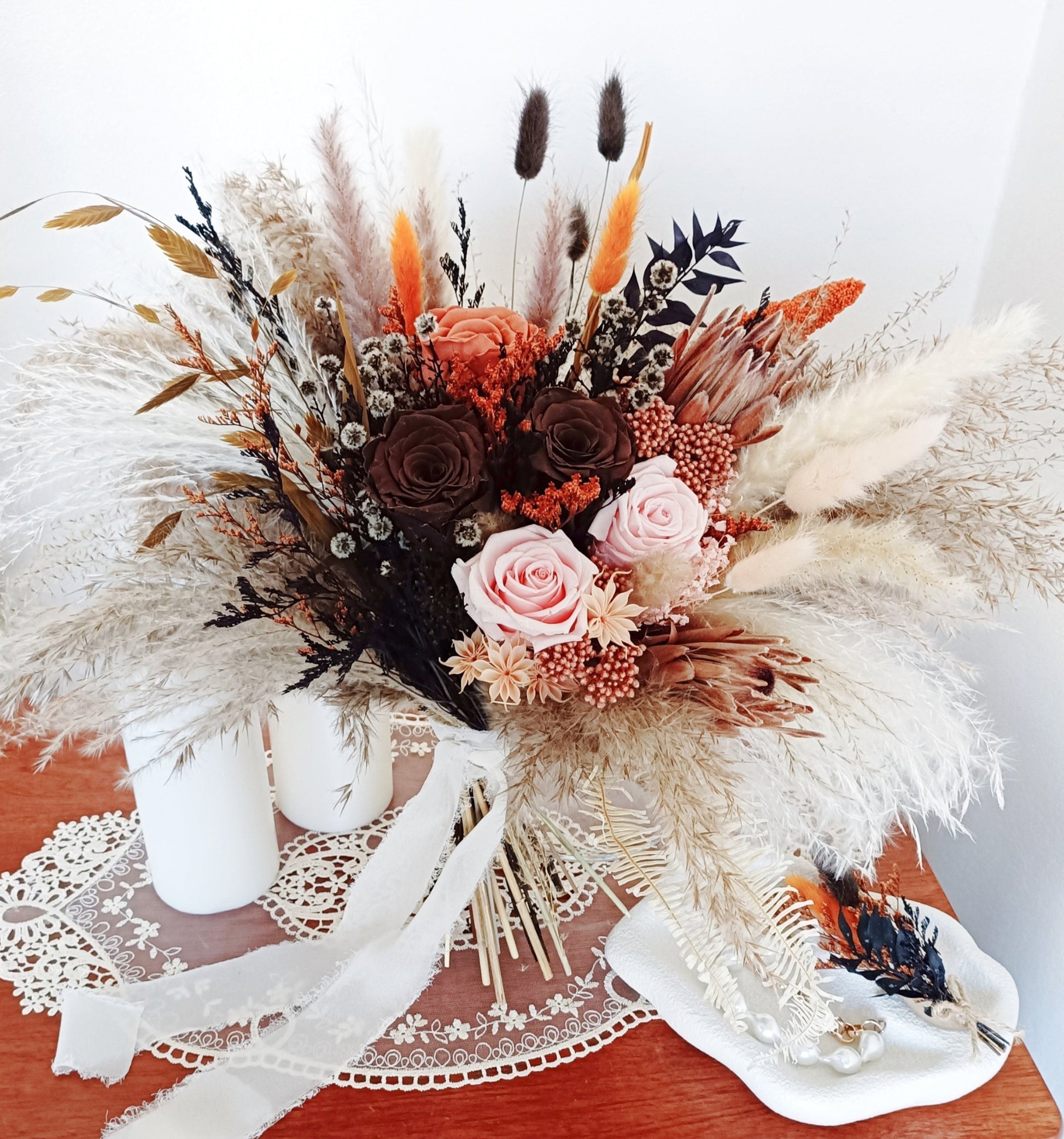Elegant neutral bridal bouquet with pampas plumes and preserved blush flowers
