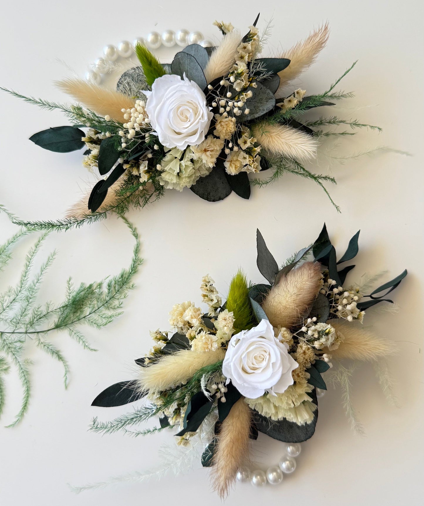Ivory and beige dried flower wrist corsage with preserved greenery, perfect for rustic weddings.