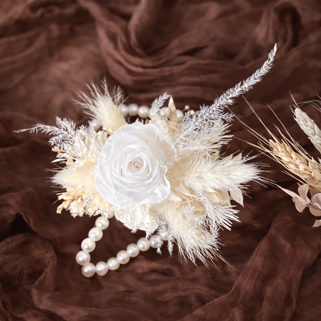 Ivory boho wrist corsage with preserved white rose, pampas grass and dried flowers