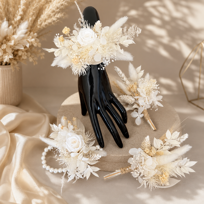 Wedding boutonniere featuring ivory dried flowers and preserved foliage