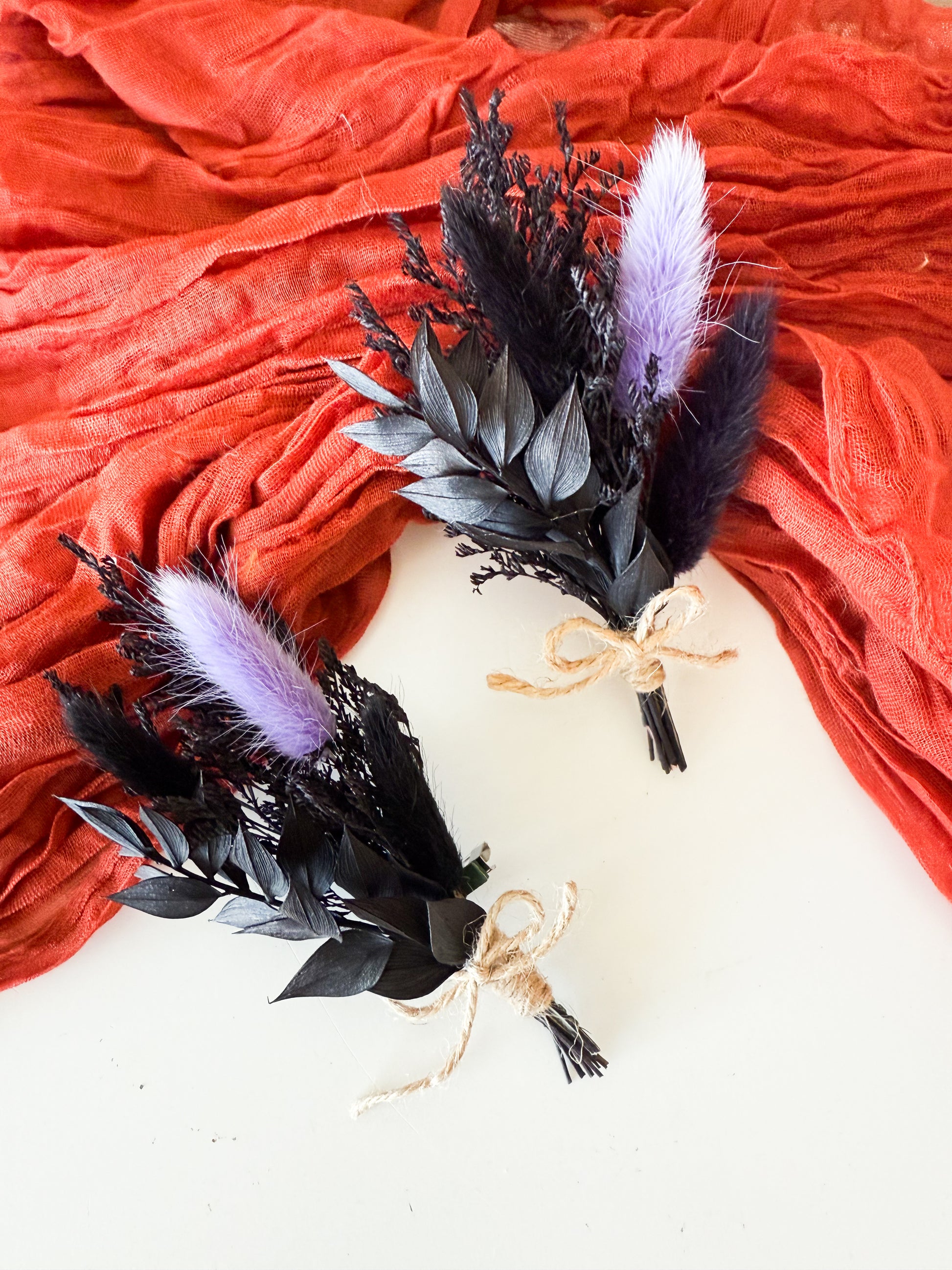 Rustic dried boutonniere in black and purple tones, handmade floral accessory for groom, groomsmen, or wedding guests.