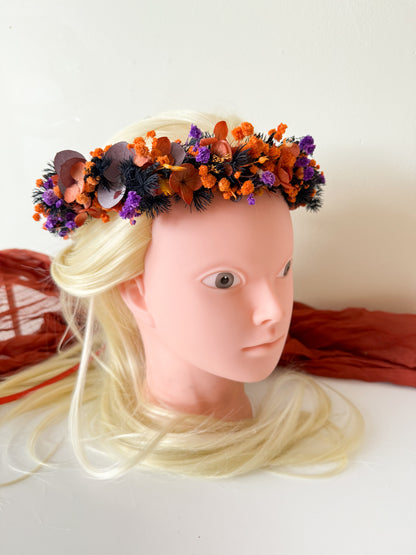 Close-up front view of dried flower headpiece in bright orange and purple tones — rustic and elegant bridal flower crown.