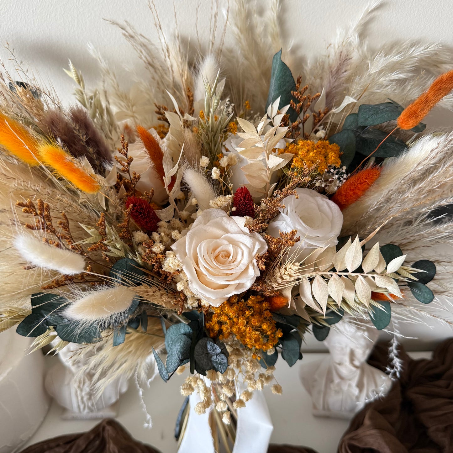 Handcrafted preserved bridal bouquet featuring ivory roses, pampas grass and Australian-inspired dried flowers