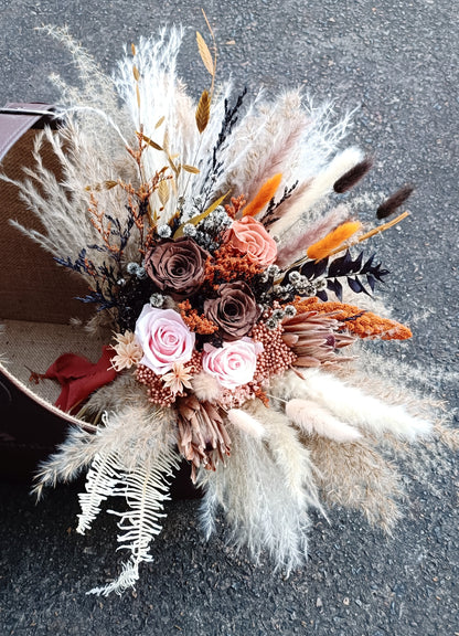 Neutral boho bridal bouquet with dried pampas grass and preserved blush roses.