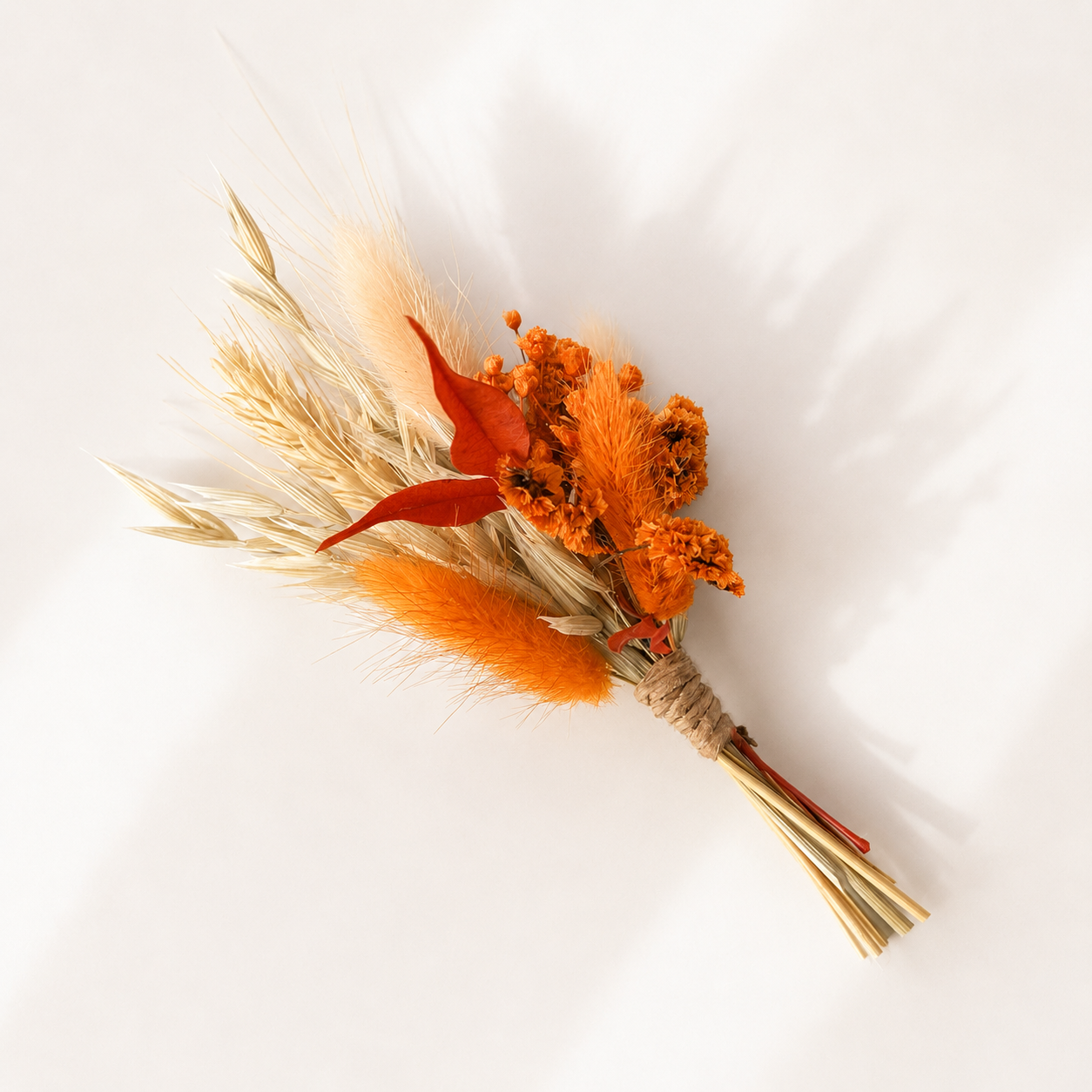Mini dried flower bouquet with orange preserved flowers and natural wheat, ideal for wedding place settings and proposal gifts.