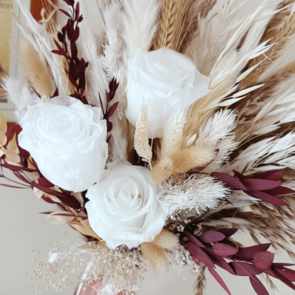 Preserved flower bouquet in creamy white, sand and wine-red hues featuring fluffy pampas, eucalyptus, bunny tails, sola roses and velvet ribbon. A long-lasting, eco-friendly choice for bohemian or rustic weddings in Australia.


