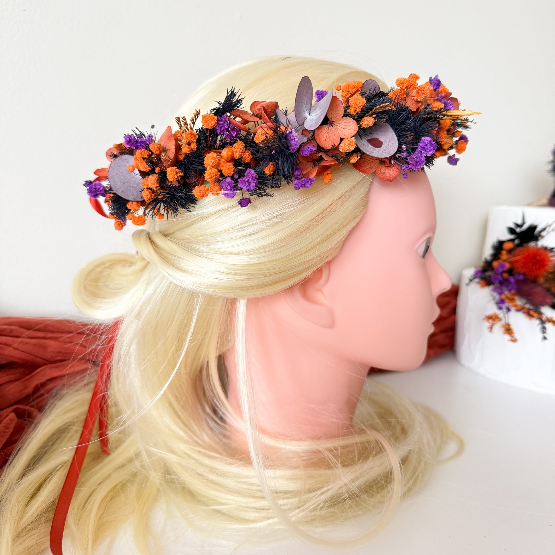 Bride hairstyle with dried flower crown tied with red ribbon — adjustable and comfortable wedding headpiece.