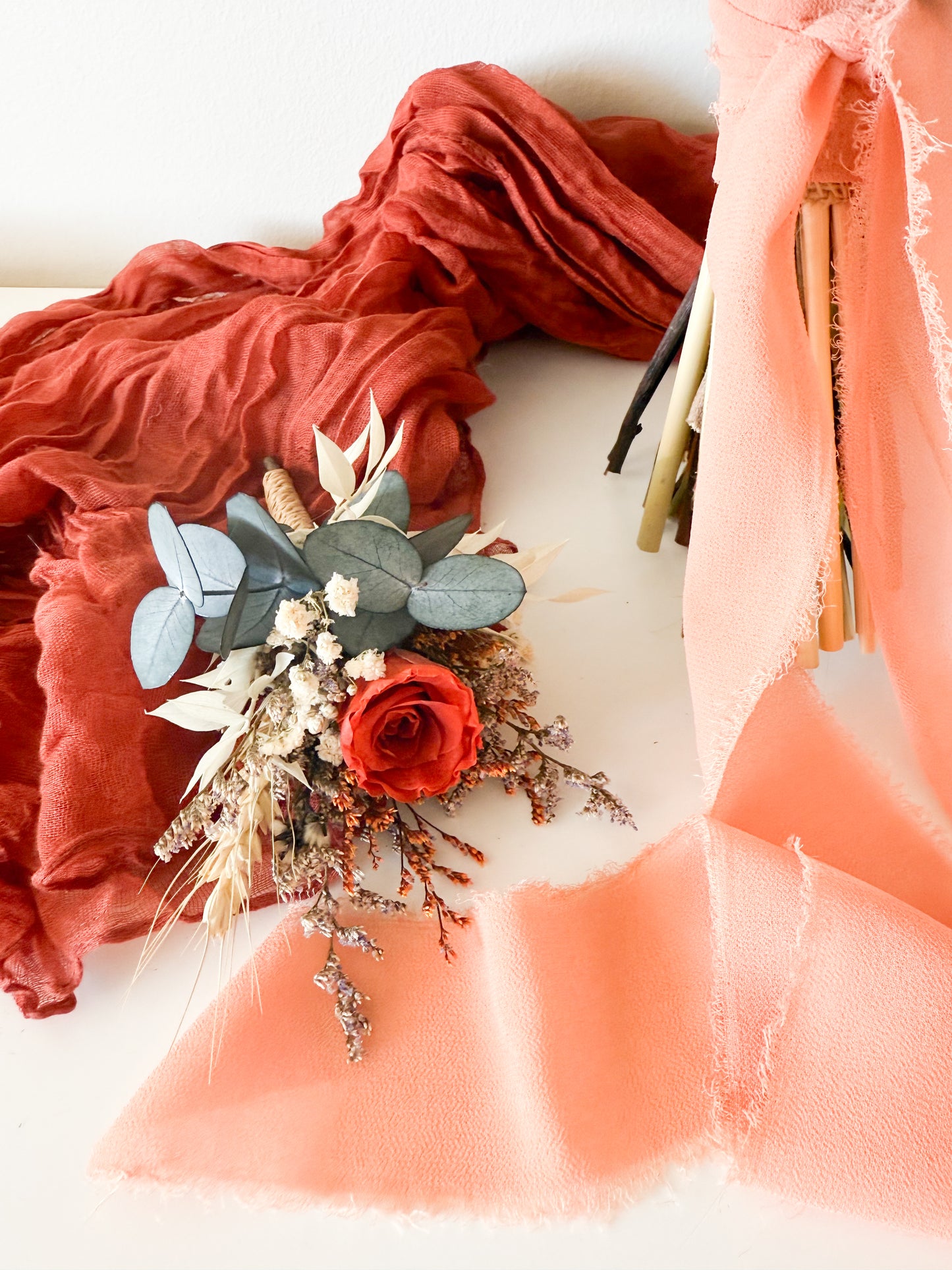 Rustic terracotta rose and banksia dried flower wedding bouquet with eucalyptus, boho natural Australian native style.