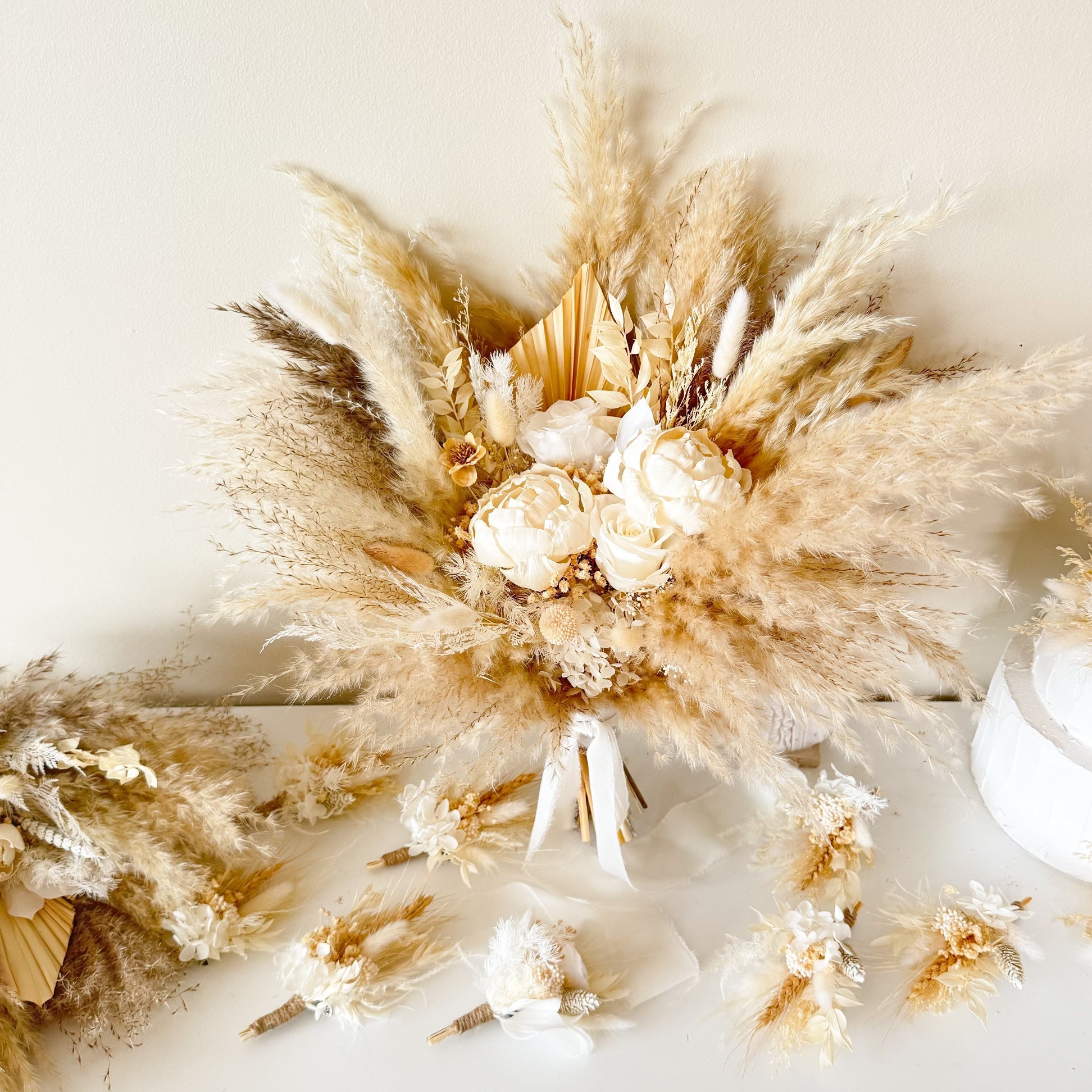 Neutral pampas grass dried flower arrangement for wedding decor in soft beige tones, perfect for luxury bridal bouquet