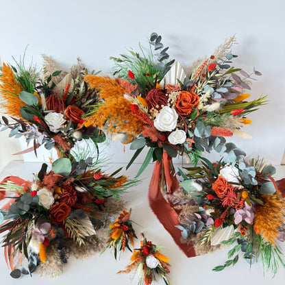 Close-up of a dried terracotta wedding bouquet featuring preserved roses, eucalyptus, bunny tails and burnt orange accents
