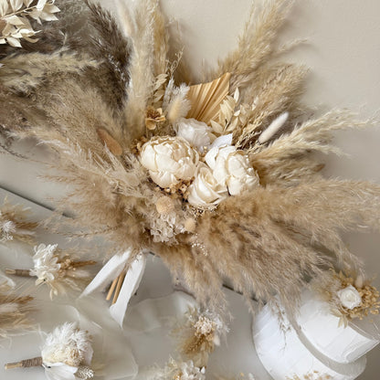 Textured pampas grass wedding bouquet with sola peonies, created in soft natural tones for luxury wedding aesthetics.