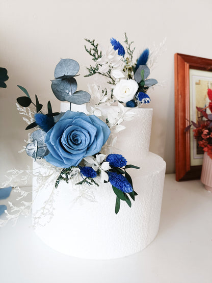 Wedding cake topper with preserved florals – blue rose, eucalyptus, bunny tails and white accents