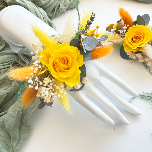 Yellow dried flower wrist corsage with preserved rose, eucalyptus, and bunny tails â€” handmade rustic wedding accessory.