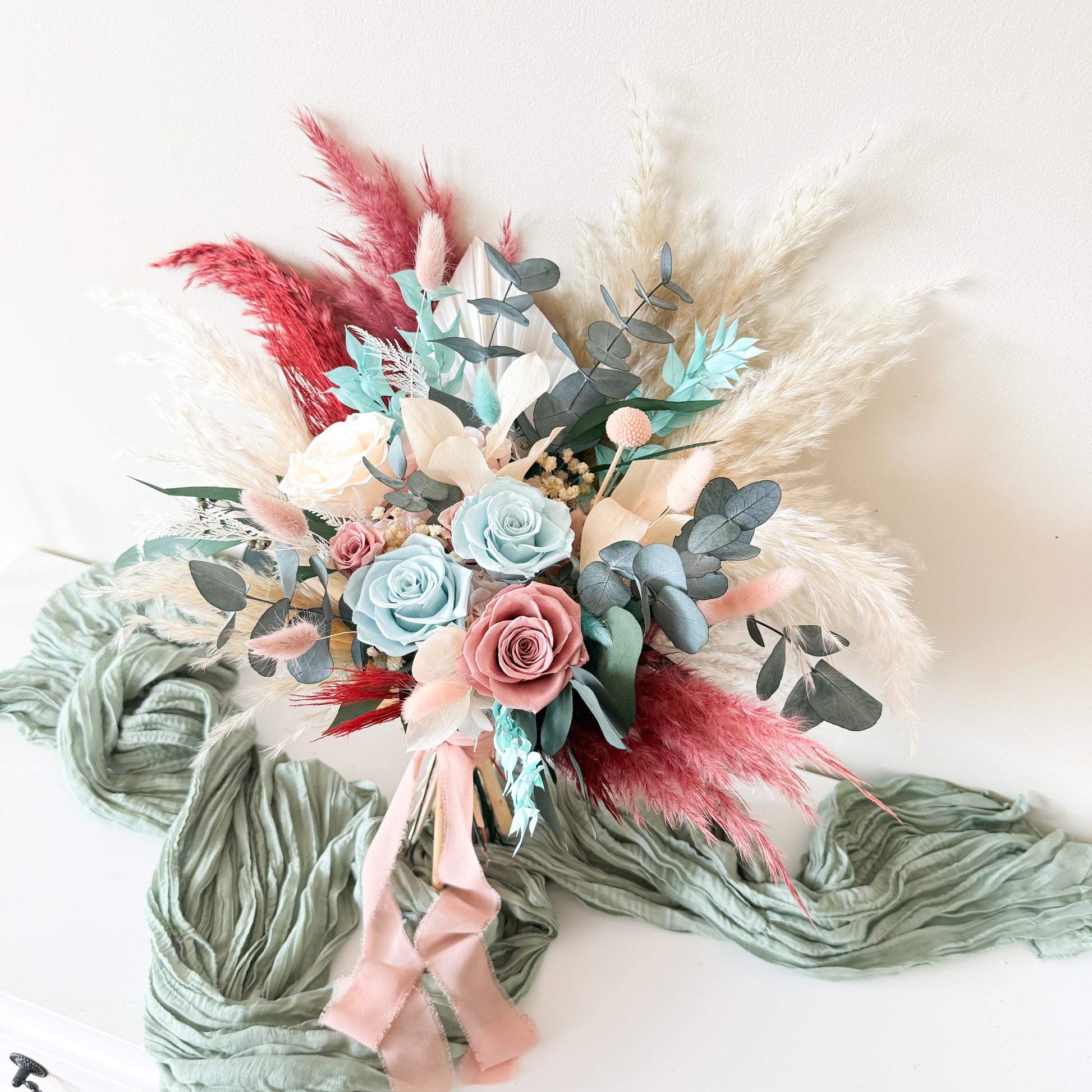 Australian dried wedding bouquet in seafoam, blush and mint tones — preserved eucalyptus, sola wood roses, fluffygrass accents
