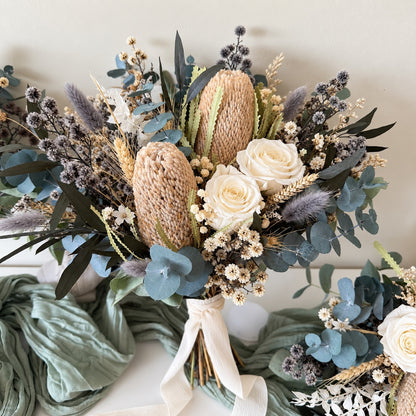 Australian native dried wedding bouquet with Banksia, preserved eucalyptus, ivory roses and neutral dried flowers