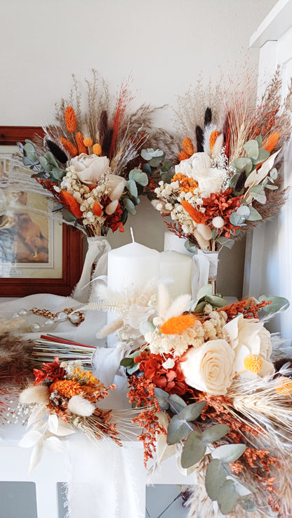 xquisite dried flower wedding bouquet, showcasing a mix of preserved roses, grasses, and eucalyptus. Designed for brides seeking a rustic, vintage look.