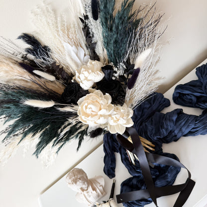 Black and ivory preserved bridal bouquet with dried flowers, roses and textured foliage