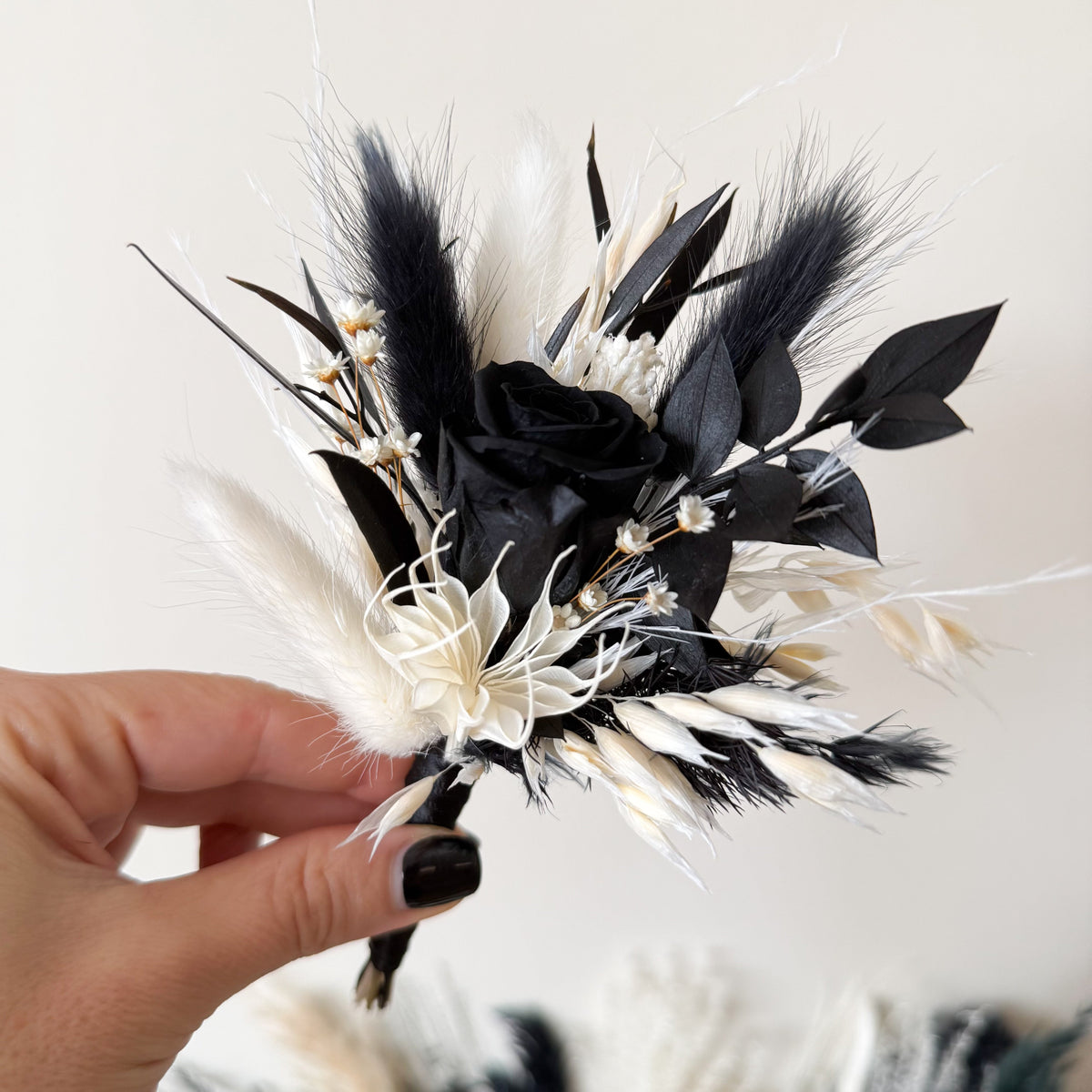 Black and white dried wedding bouquet with matching preserved flower accessories