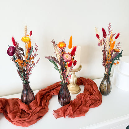 Boho autumn dried flower arrangement with orange, burgundy, and pink tones, preserved eucalyptus, and bunny tails. Handmade in Australia and sold without vase