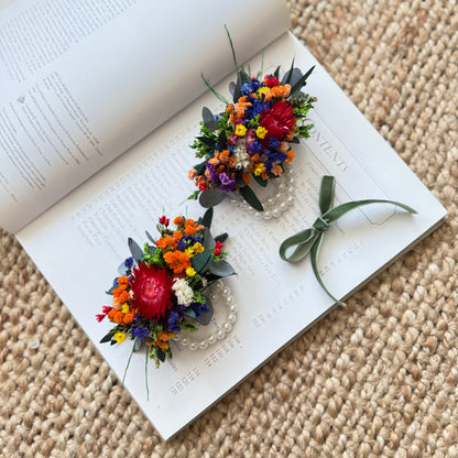 Boho colorful dried flower corsage for weddings, featuring mixed bright blooms and eucalyptus leaves