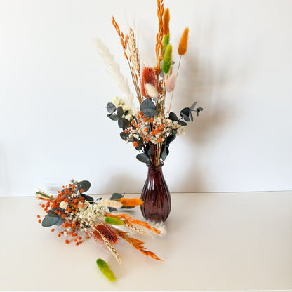 Boho vase decor featuring orange, ivory, and green dried flowers with eucalyptus, perfect for rustic or autumn styling