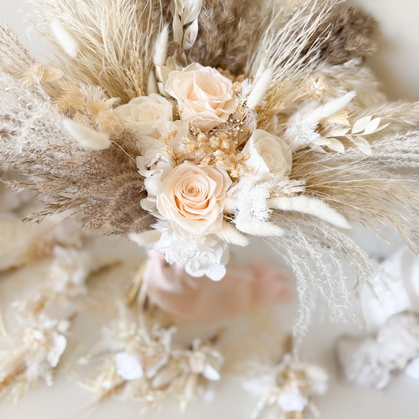 Boho wedding bouquet with ivory roses, pampas grass, dried florals and soft neutral tones