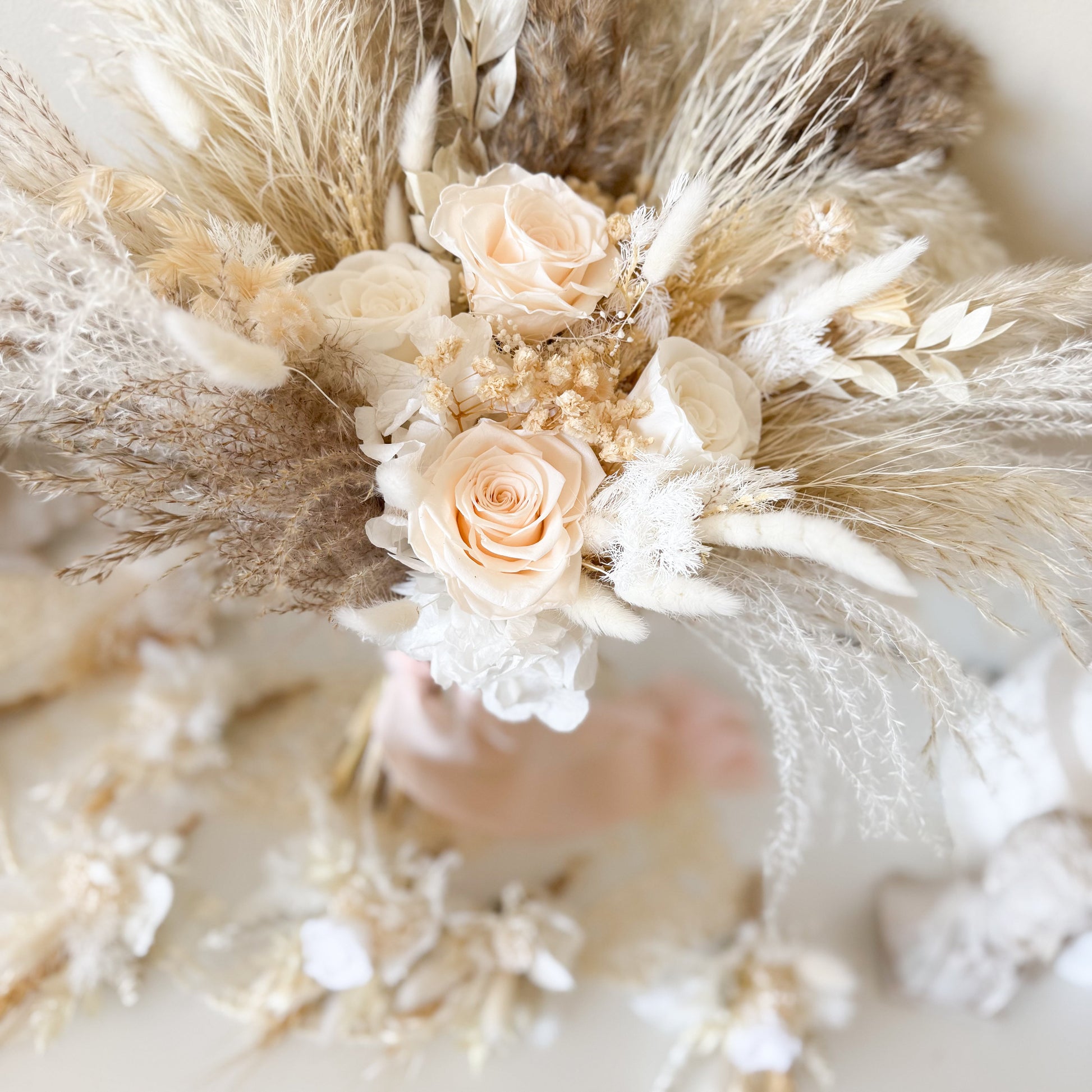 Boho wedding bouquet with ivory roses, pampas grass, dried florals and soft neutral tones
