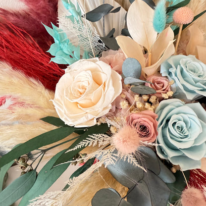 One-sided seafoam mint and blush dried wedding bouquet with fluffygrass and eucalyptus — rustic boho bridal arrangement