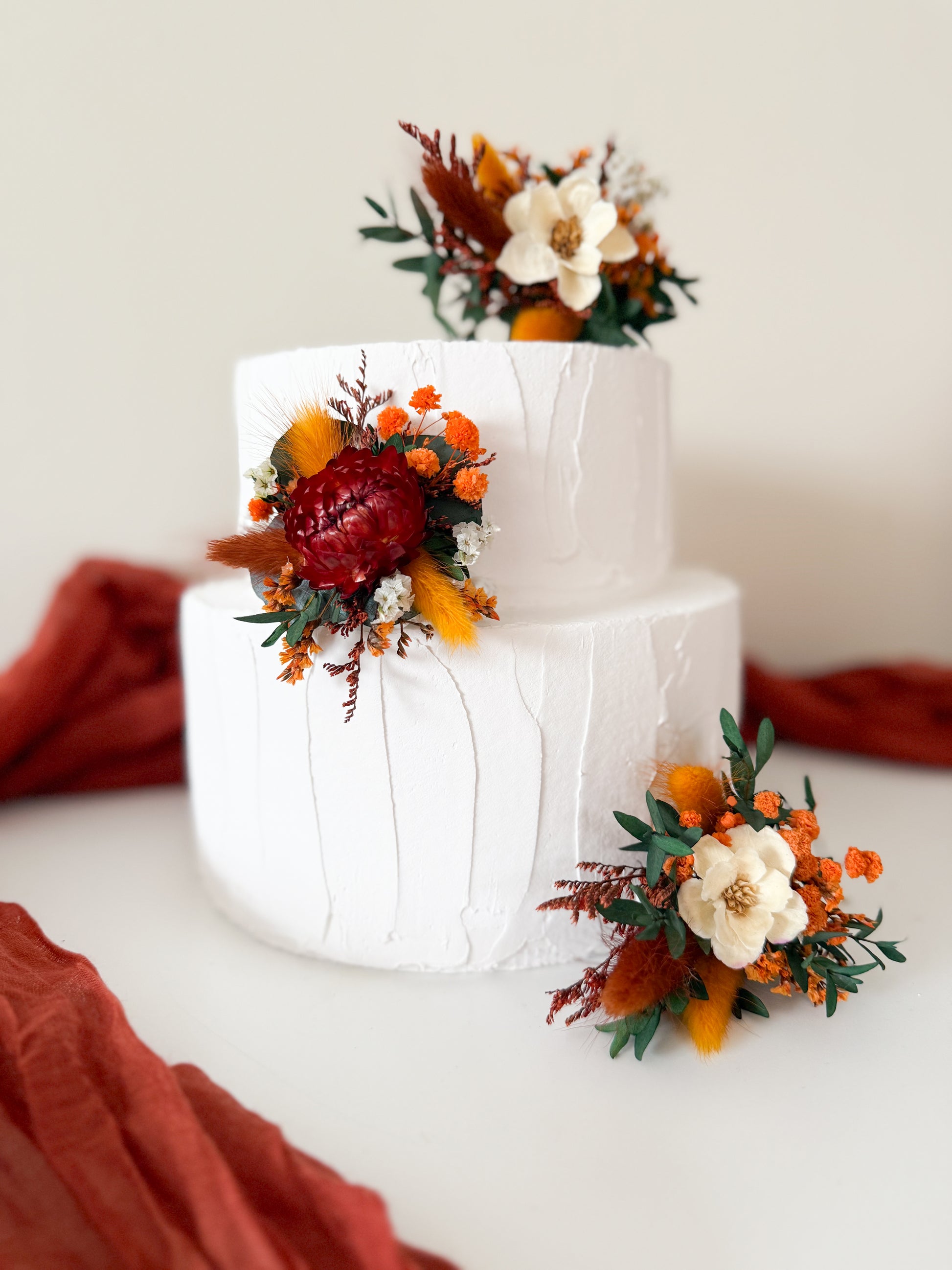Boho dried flower cake topper in burnt orange, ivory and olive tones handmade in Australia