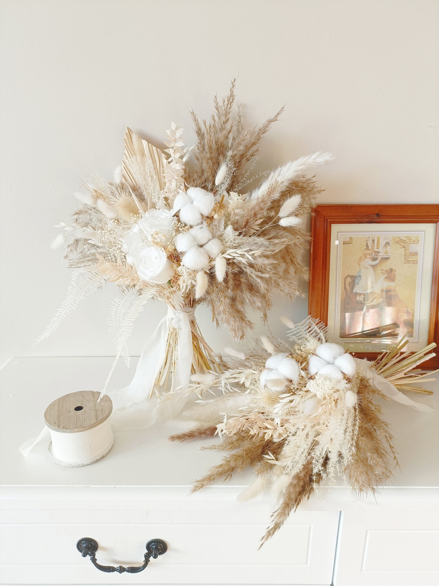 Neutral dried flower bridal bouquet with ivory roses, cotton, pampas grass, and preserved blooms. Elegant boho wedding bouquet in beige and white tones, perfect for rustic and minimalist brides.