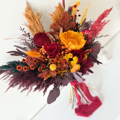 Burgundy dried bridal bouquet with sunflower, preserved roses and wheat, boho wedding flowers