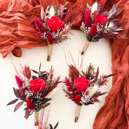 Rustic dried boutonniere with red rose, pampas and foliage, handmade boho groomsmen accessory, wedding boutonniere in burgundy and neutral tones for rustic style weddings.