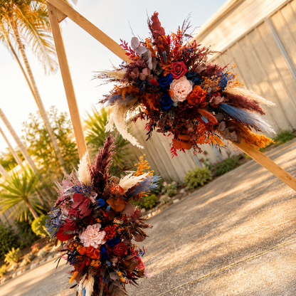 Burgundy, terracotta and navy blue dried wedding arch arrangements for boho and rustic weddings