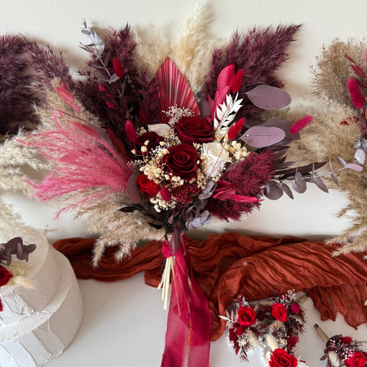 Burgundy and blush dried flower wedding bouquets with pampas grass and preserved roses, styled for Australian brides