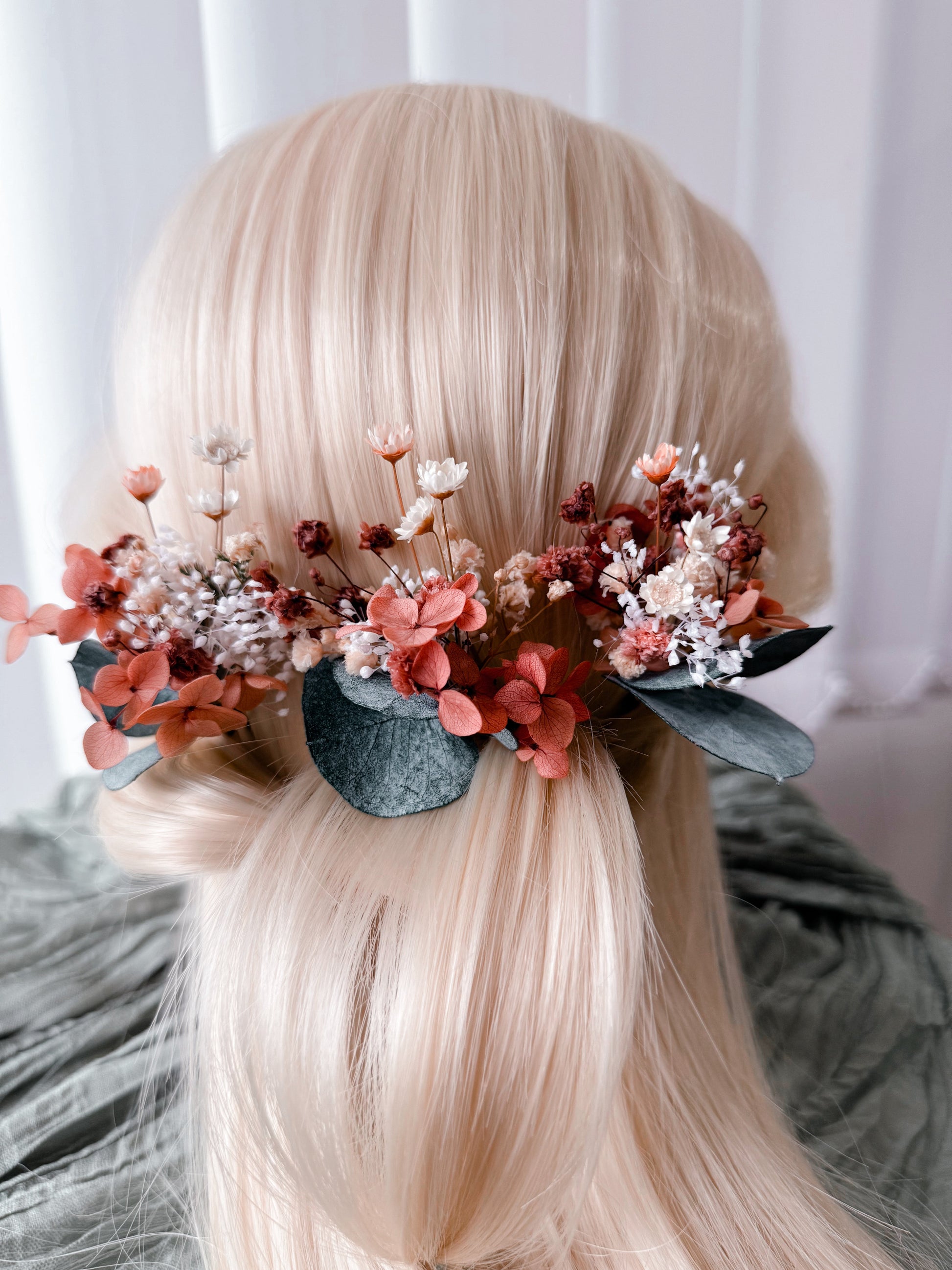 Back view of a burnt orange dried flower bridal hairpiece featuring preserved flowers, baby's breath and eucalyptus for rustic and boho Australian weddings.