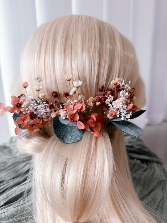 Back view of a burnt orange dried flower bridal hairpiece featuring preserved flowers, baby's breath and eucalyptus for rustic and boho Australian weddings.