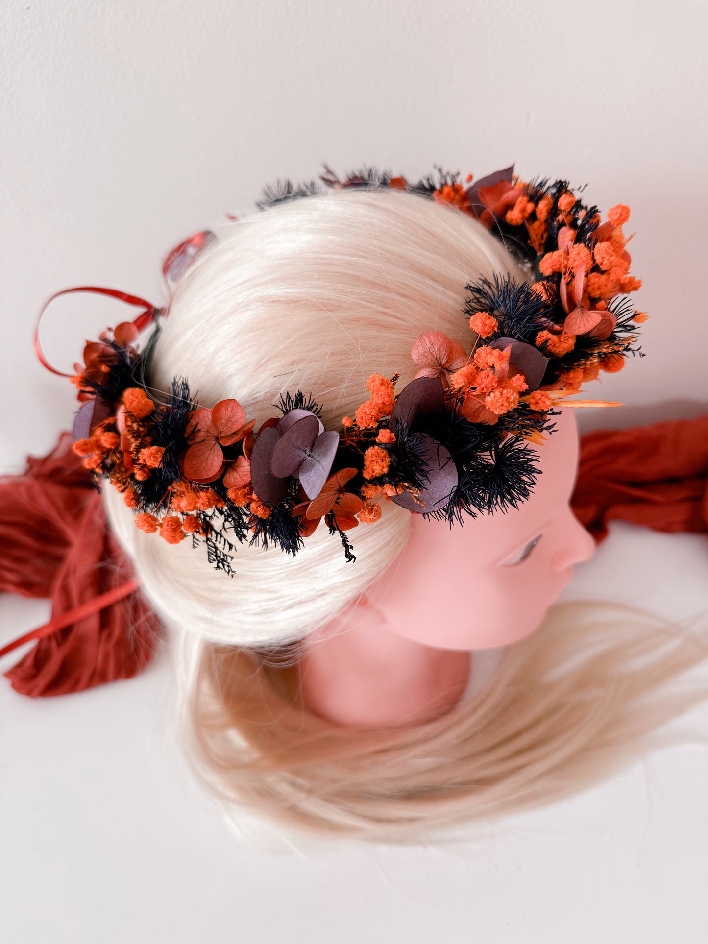 Back view of dried flower crown tied with red satin ribbon – perfect for boho brides