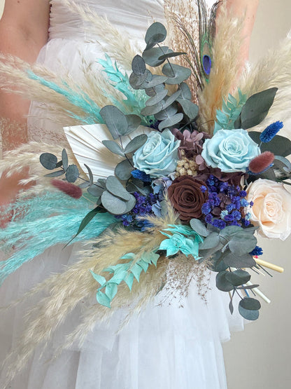Natural dried bouquet in teal and blue tones, perfect for coastal and rustic weddings.
