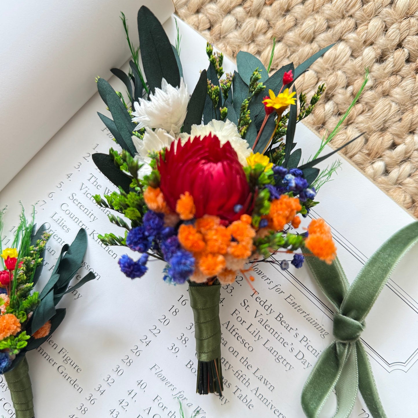 Dried bright boutonniere in rich red and orange tones with Australian rustic wedding style
