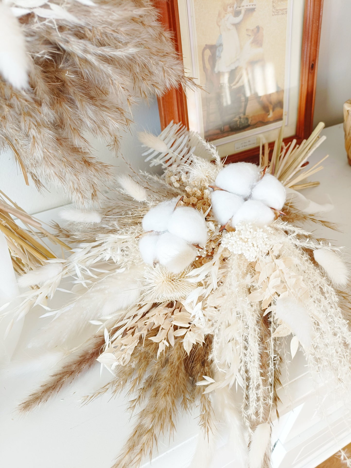Neutral dried flower buttonhole with preserved cotton, pampas grass and bleached foliage – elegant accessory for grooms and weddings in Australia.