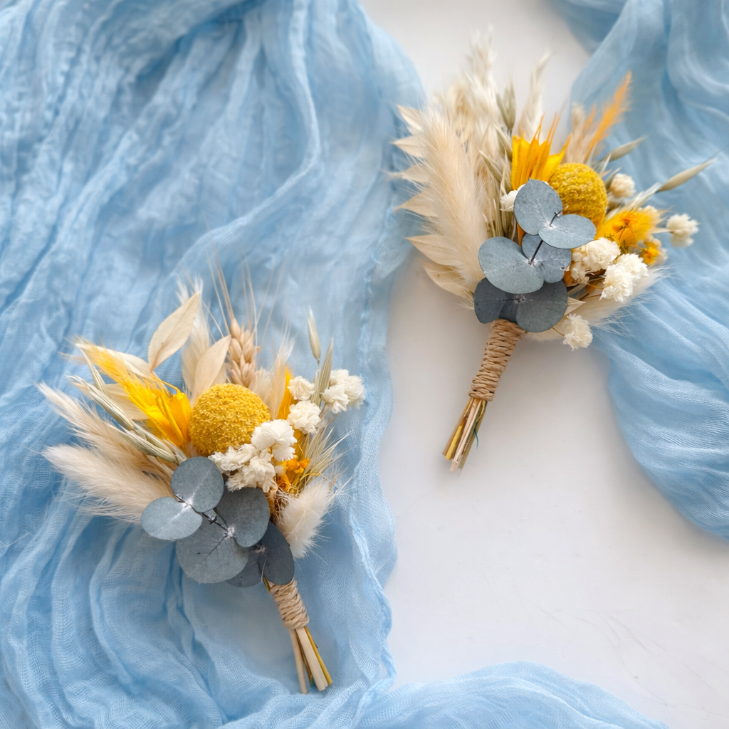 Groom boutonniere and matching dried flower accessories in blue, beige and yellow boho wedding style
